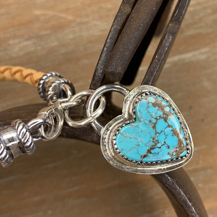 Natural braided leather bracelet with a turquoise heart charm