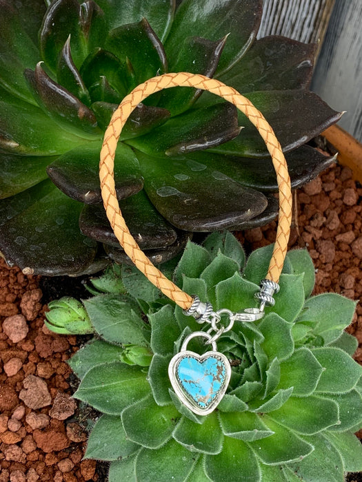 Natural braided leather bracelet with a turquoise heart charm