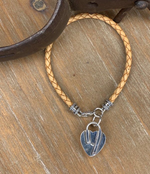 Natural braided leather bracelet with a turquoise heart charm