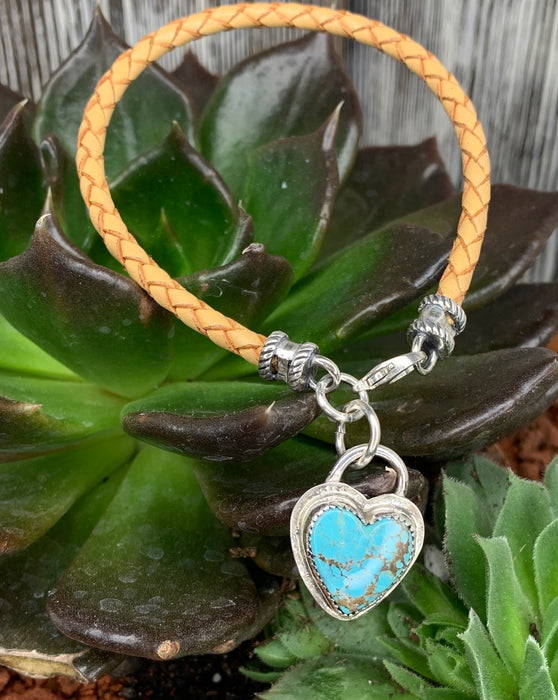 Natural braided leather bracelet with a turquoise heart charm