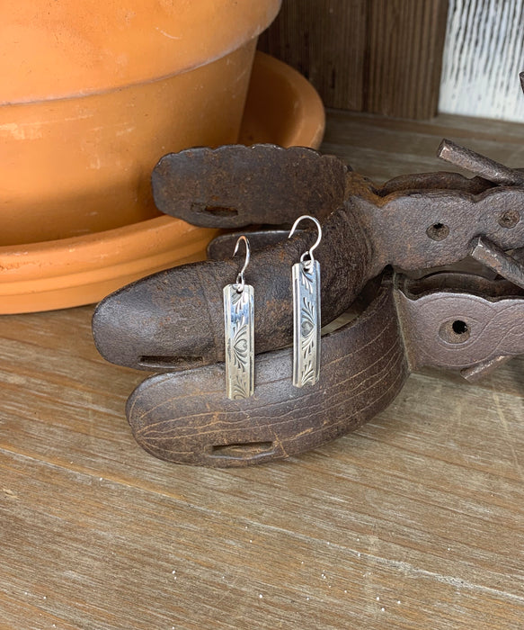 Long silver drop with heart pattern earrings