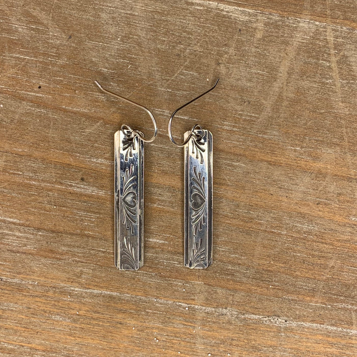 Long silver drop with heart pattern earrings